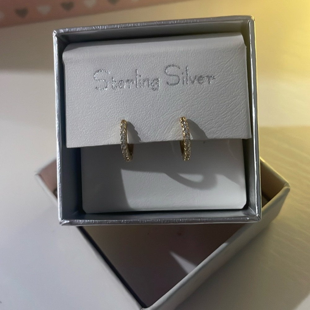 Never worn sterling silver diamond accented earrings for infant/toddler child.